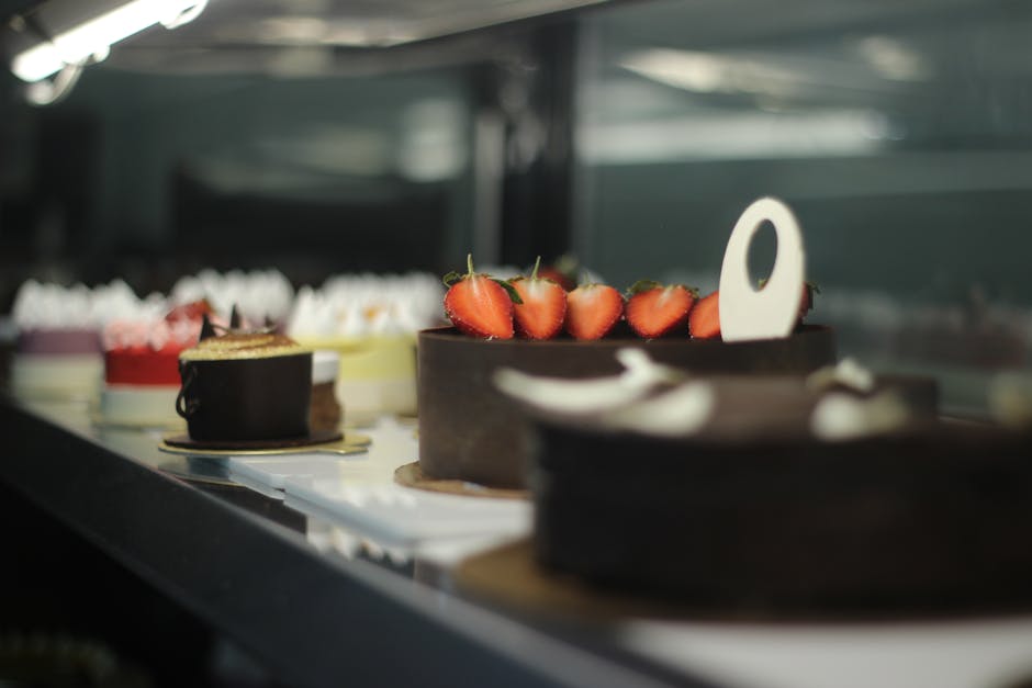 Assorted cakes displayed beautifully in a stylish café, offering a delightful and sweet indulgence.